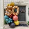 Custom balloon colors make this fall 50th birthday balloon installation gorgeous - from Just Peachy in Little Rock.