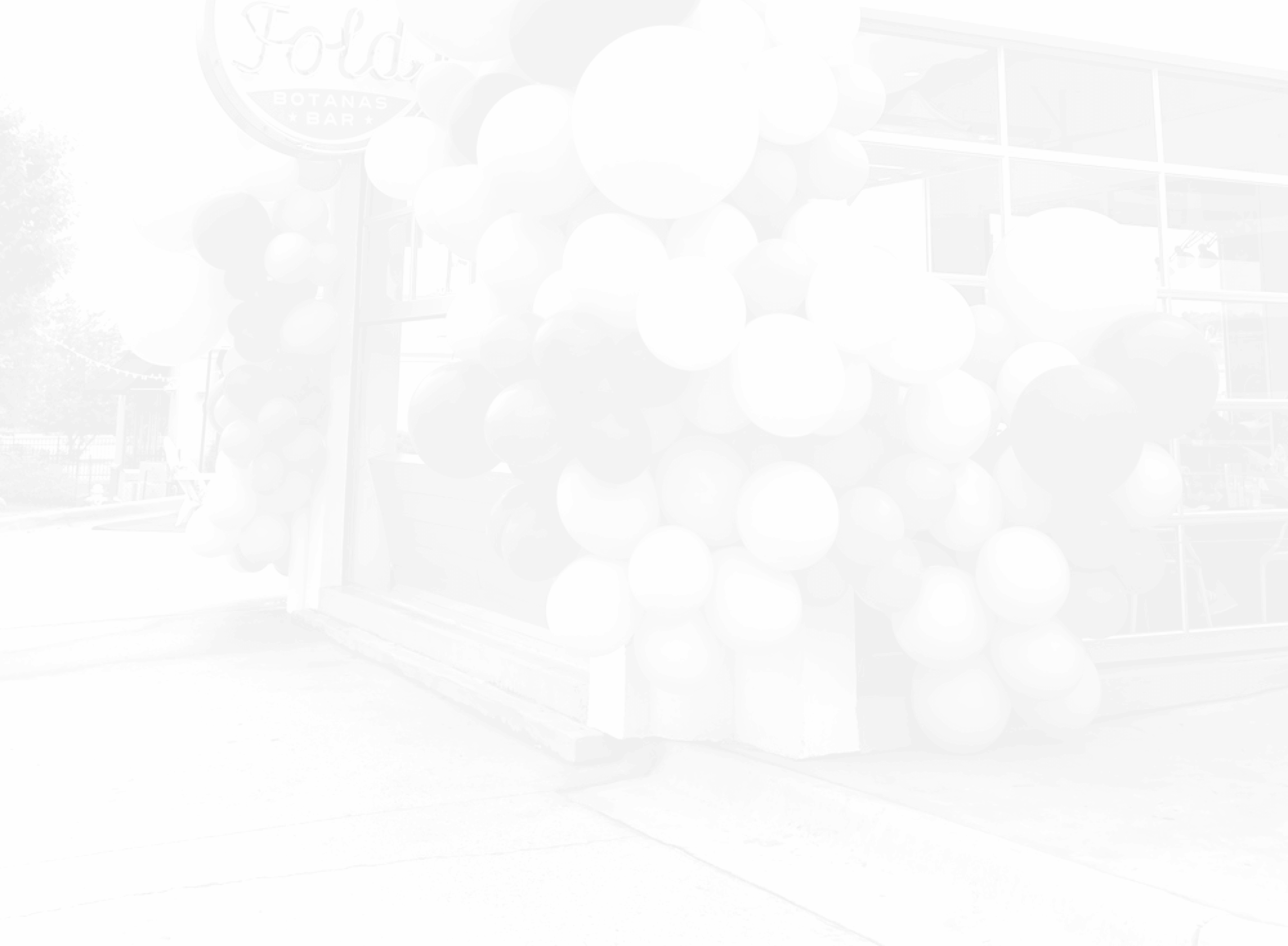 Background image of The Fold restaurant in Little Rock, Arkansas, featuring a Just Peachy balloon installation.