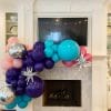 Make a mantle gorgeous with a balloon garland installation like this one for a birthday celebration from Just Peachy.