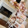Happy Birthday baby with a beautiful mantle balloon garland hanging from Just Peachy in Little Rock, Arkansas,