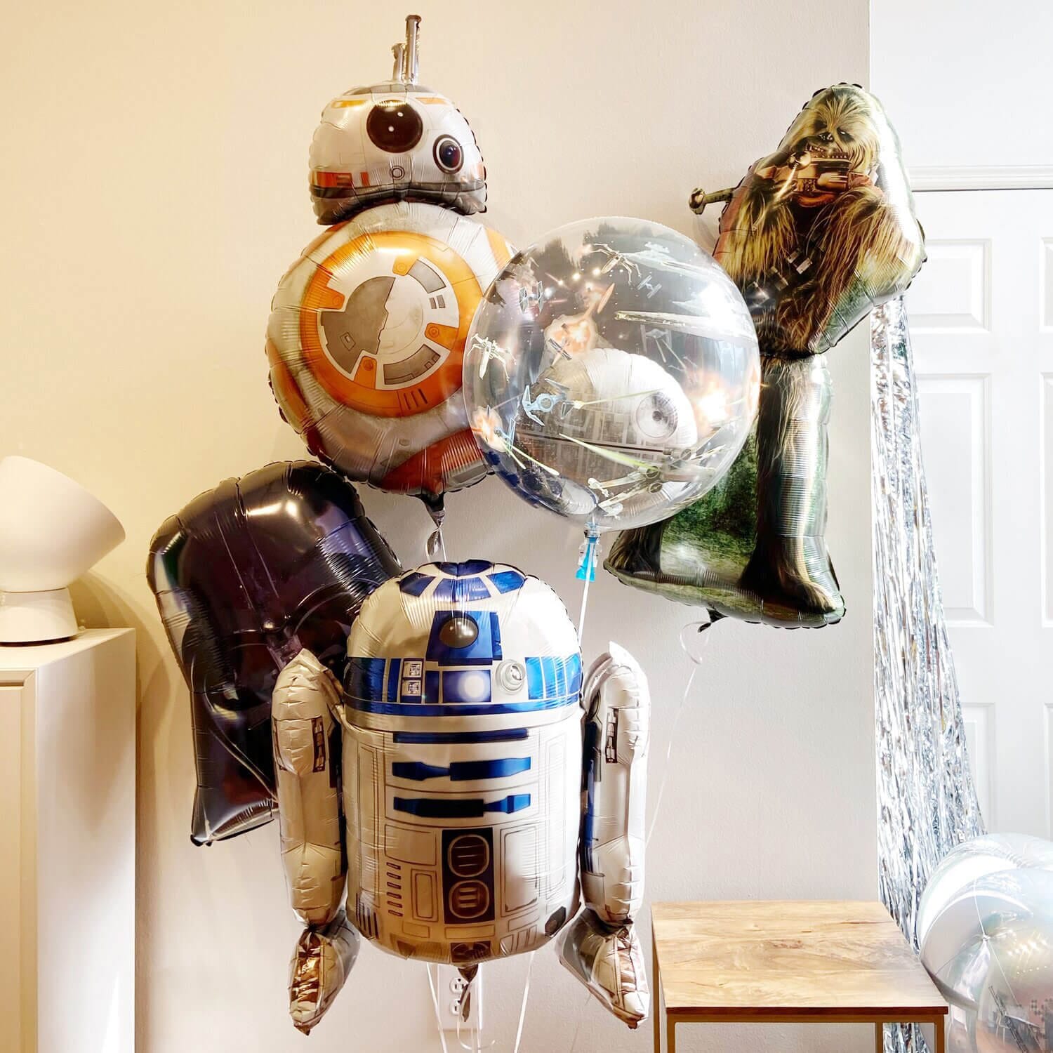 Oversized helium bouquet with Chewbacca, Darth Vader, Death Star Galaxy, R2-D2, and BB8 helium balloons from Just Peachy in Little Rock, Arkansas.