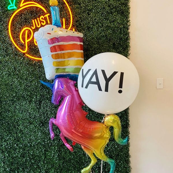 Wish the happiest of birthdays with this helium balloon bouquet: a rainbow glitter unicorn, slice of birthday cake, and giant YAY balloon.