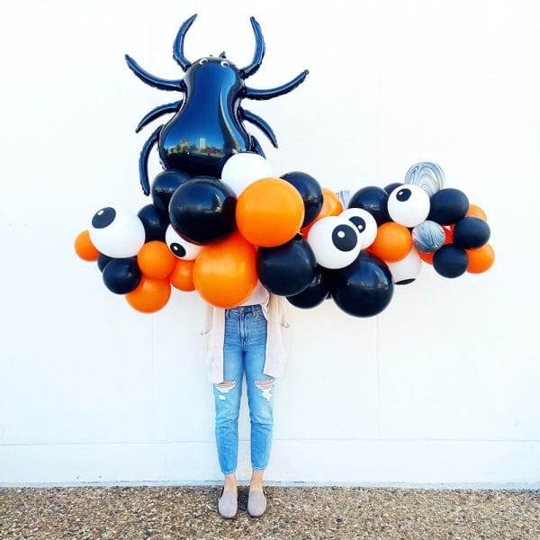 Orange, black, agate, and eyeball balloons make a spooky Halloween garland from Just Peachy in Little Rock.