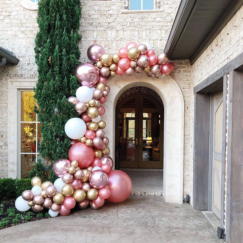 Just Peachy custom color doorway balloon arch install with rose gold, white, peach, and gold metallic balloons in central Arkansas.