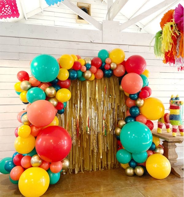 Gold Streamer photo backdrops with fiesta themed balloon display from Just Peachy in Little Rock, Arkansas.
