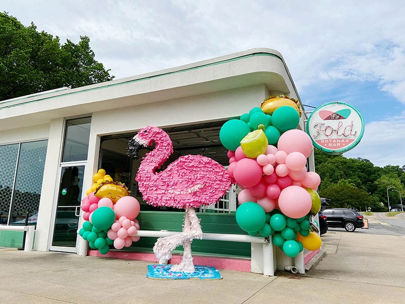 The Fold loves this Just Peachy custom flamingo, margarita, and taco balloon arch install in Little Rock, Arkansas.