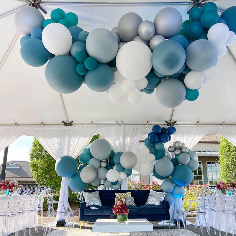 For large tents, Just Peachy can create entrances, backdrops and chandelier ceiling hangings with giant balloons to fit your color and event theme, like this one at Face of Grace Esthetics grand opening in Little Rock, Arkansas.