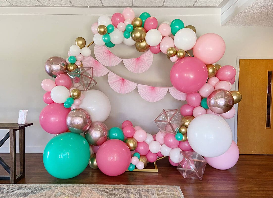 Just Peachy rents backdrops, like this large round copper arch with balloons, for weddings, parties, showers, and events in central Arkansas.
