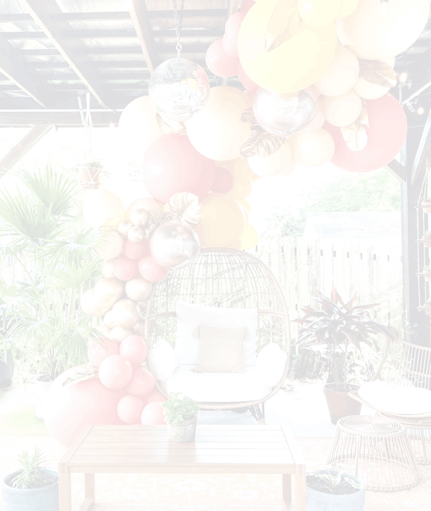 Custom balloon installation around hanging chair by Just Peachy in Little Rock, Arkansas.