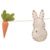 Sweet fabric bunny tails and carrot shapes make a happy spring garland from Just Peachy in Little Rock.