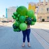 Shades of green balloons plus shiny green shamrocks in a happy burst for your office or home from Just Peachy.