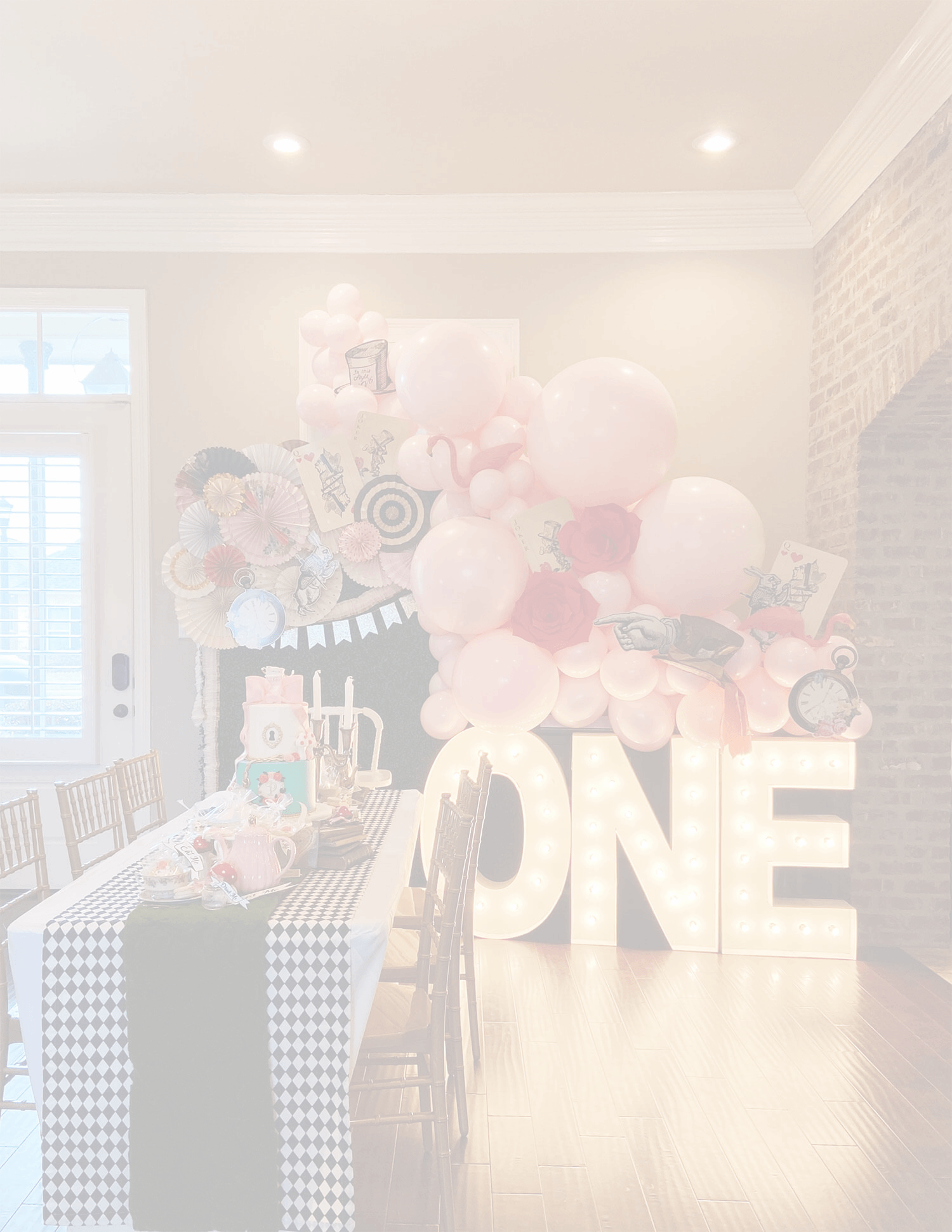 Just Peachy styling including balloons, marquee letters, table decorations, cookies, and cake for an Alice In Wonderland themed birthday party.